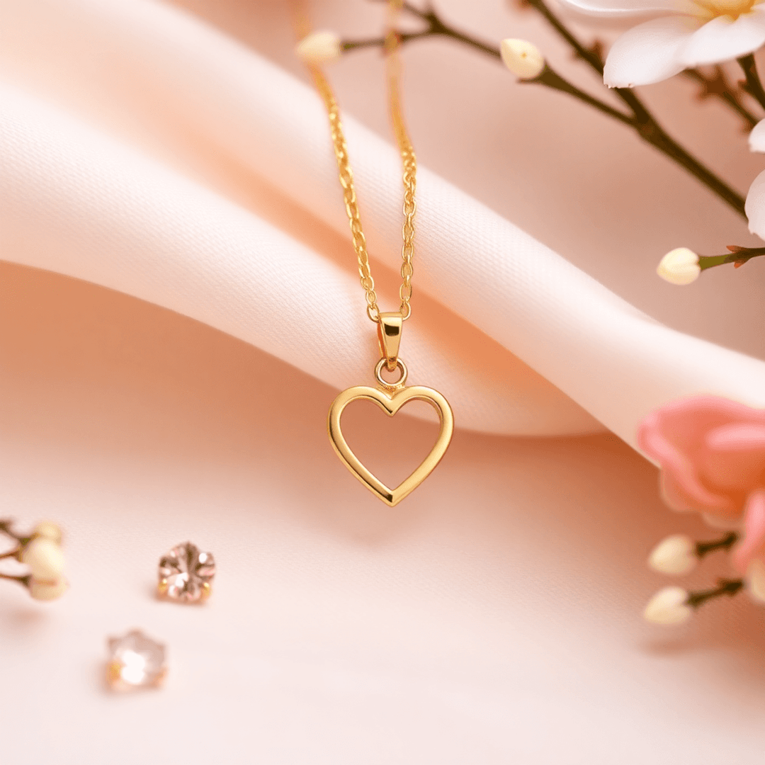Close-up of a delicate gold heart-shaped necklace on soft fabric, accented with birthstones and gentle floral details, evoking warmth and timeless love.
