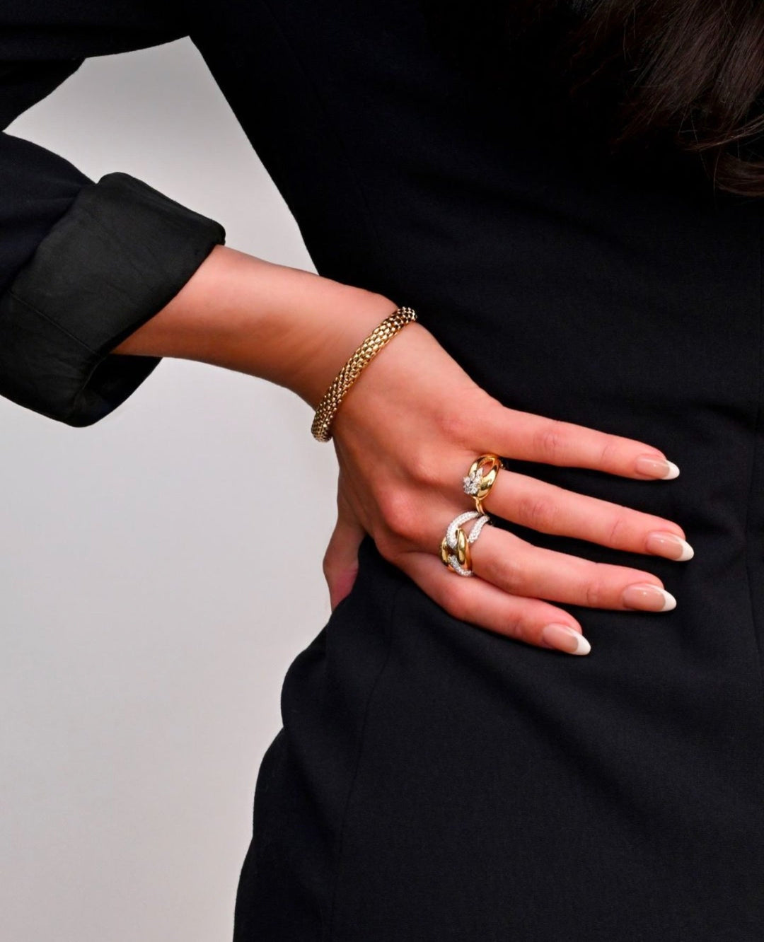 Stacked to perfection ✨ Mixed-metal fashion rings blend bold gold and diamond sparkle